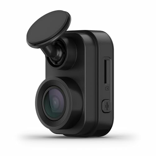 Compact black dash cam with lens and mount.